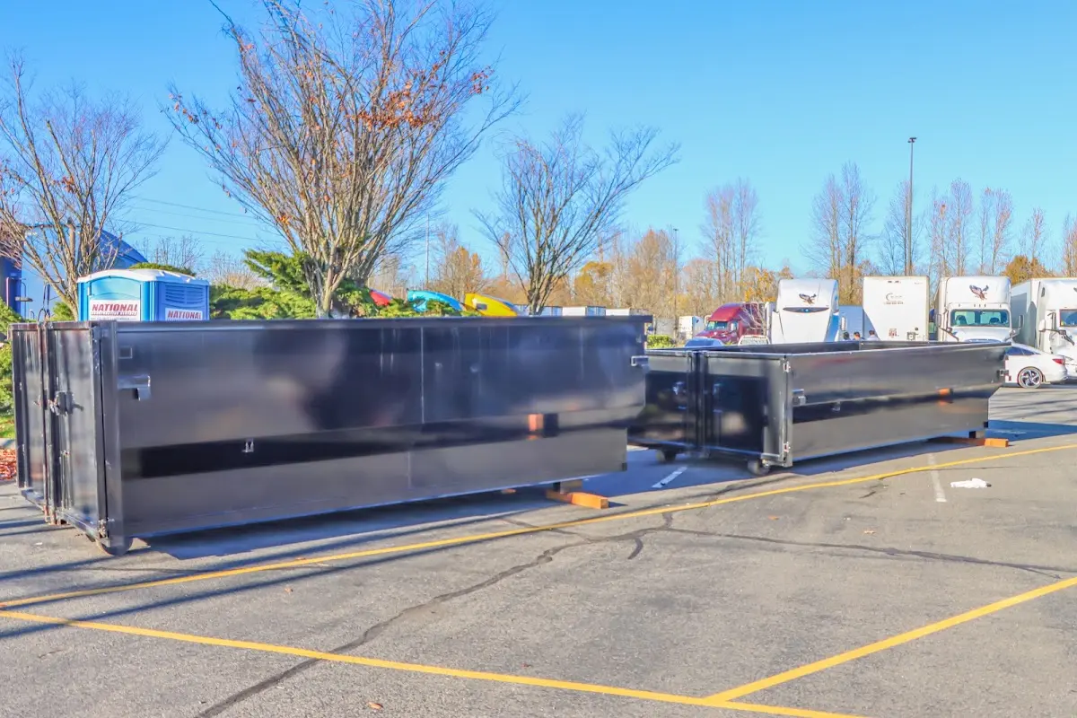 Professional dumpster rental service with roll-off container on residential driveway in Sun Lakes